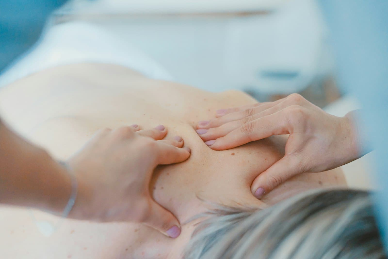 A physiotherapist providing hands-on treatment to a patient