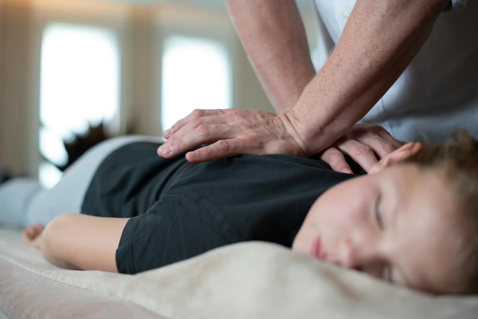 A therapist providing hands-on treatment