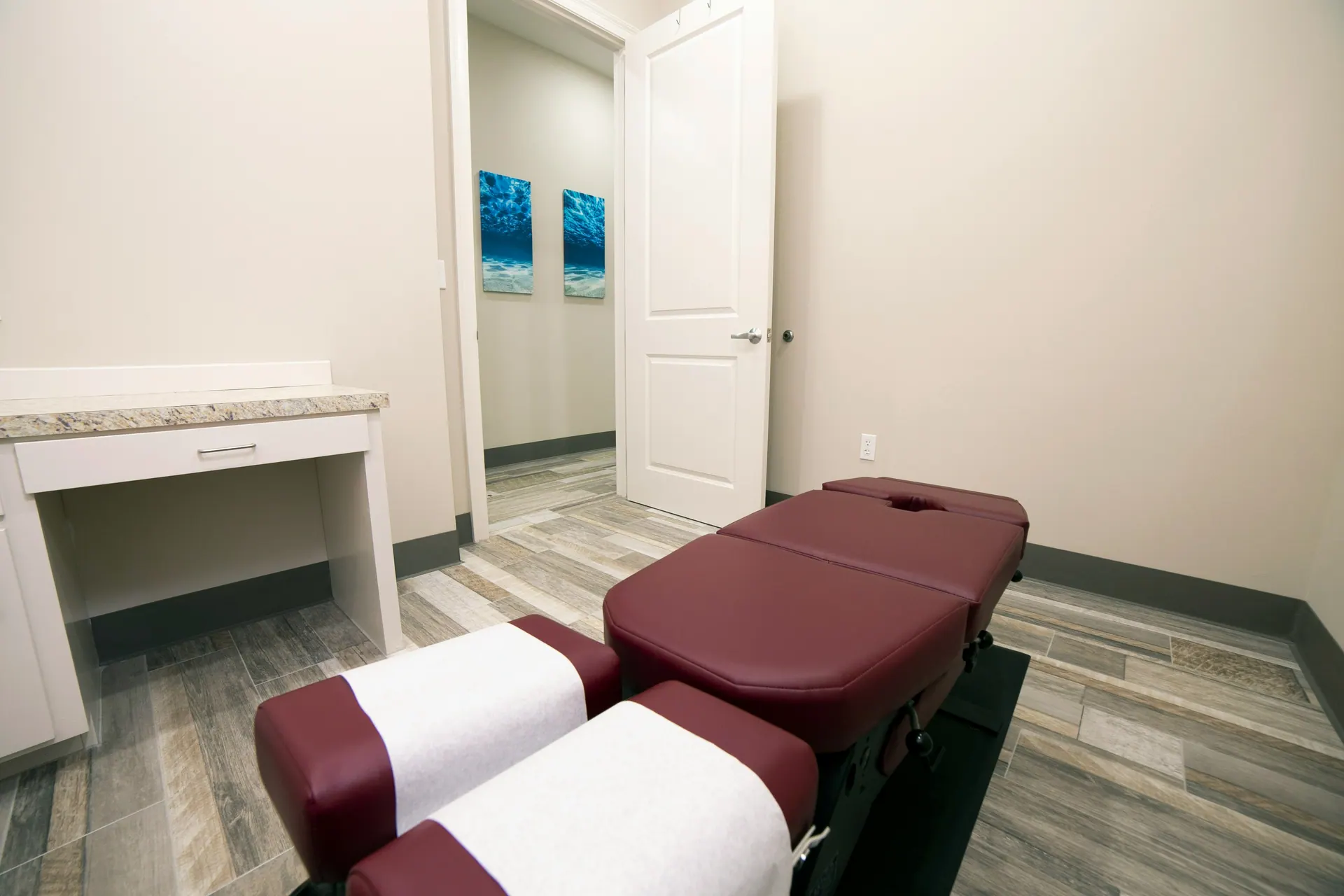 A private treatment room with an adjustment table