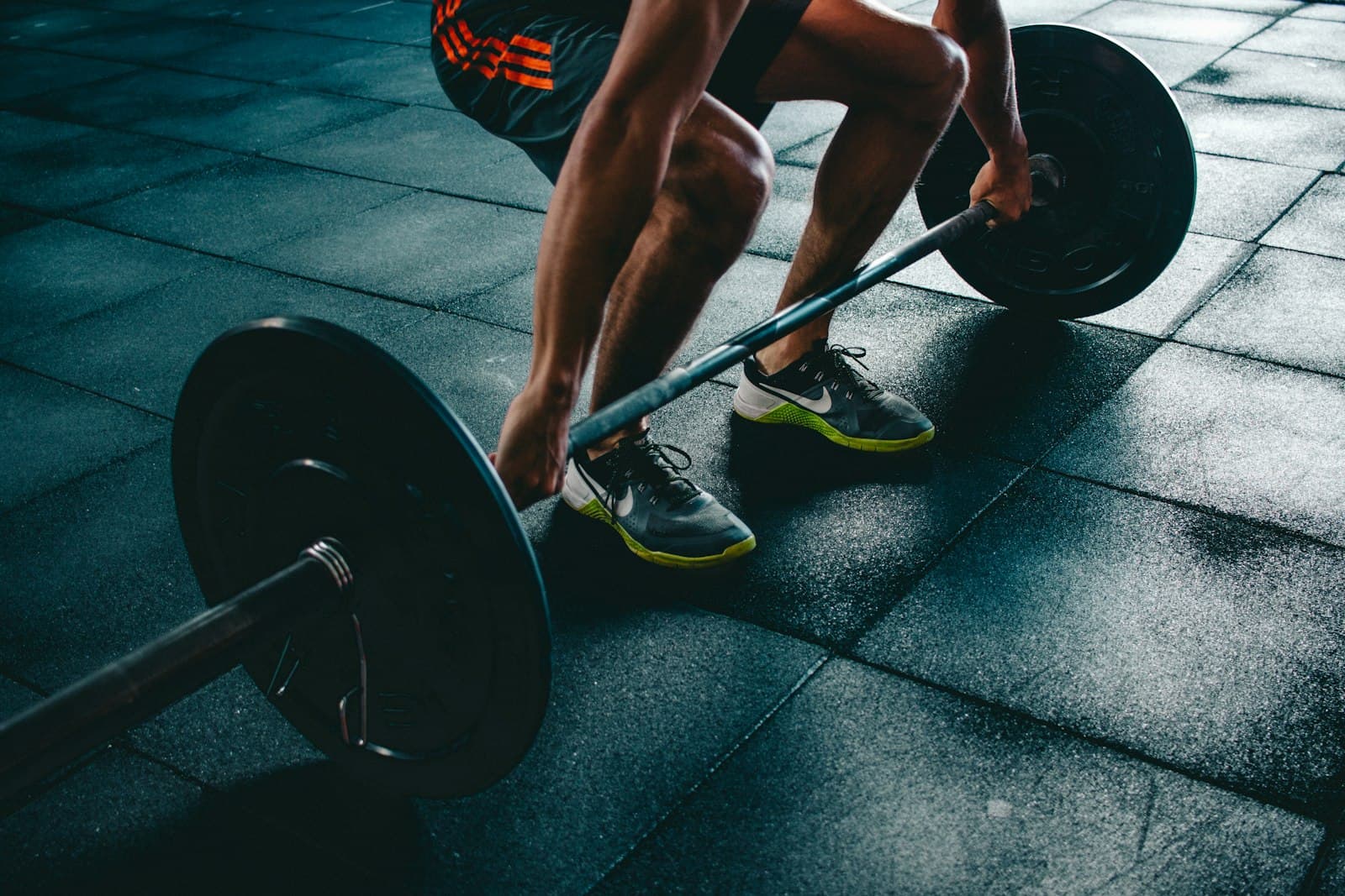 A person working through a strength exercise with resistance equipment